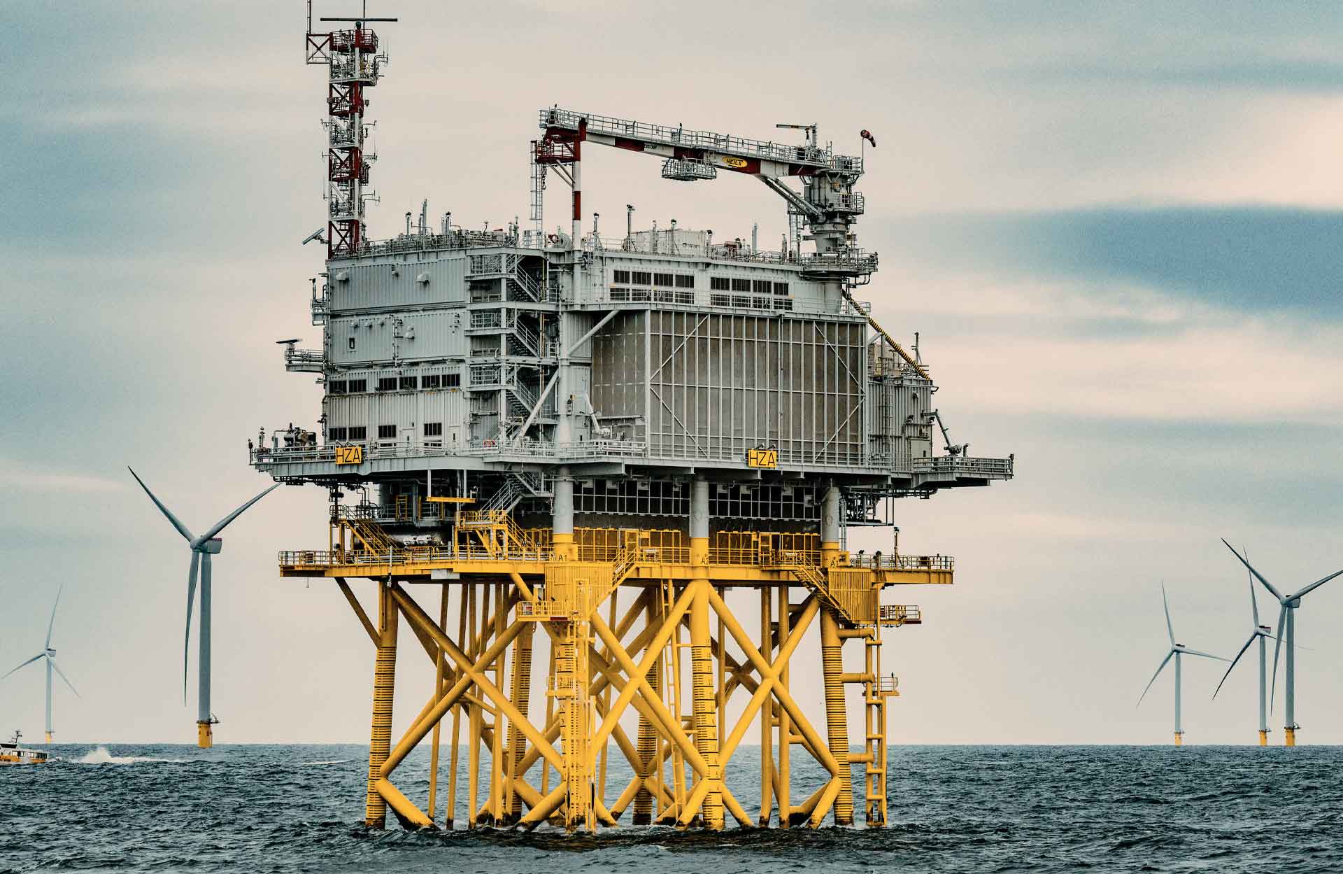 Offshore substation surrounded by wind turbines
