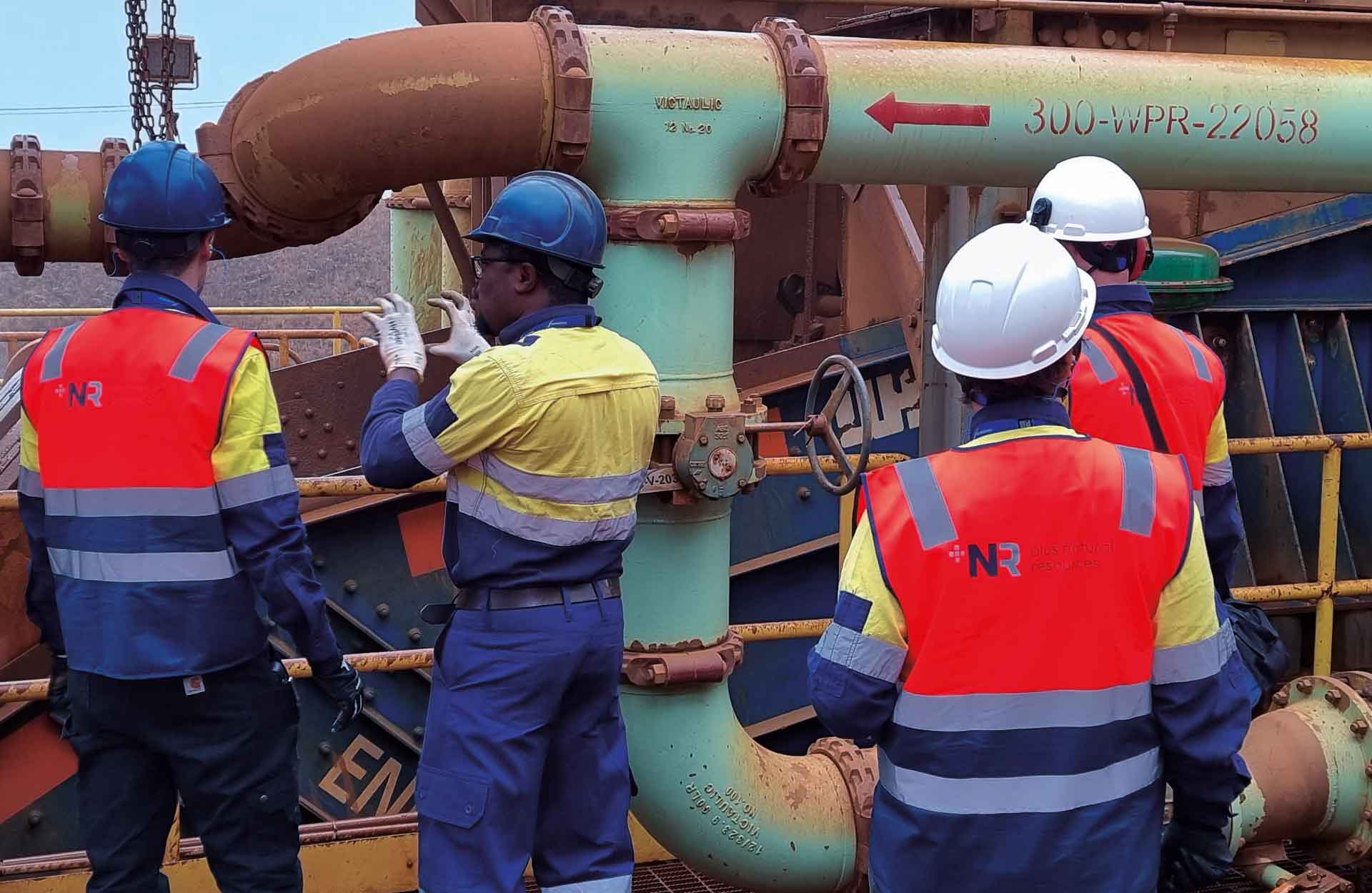 Plus Natural Resources engineers inspecting process piping at a plant